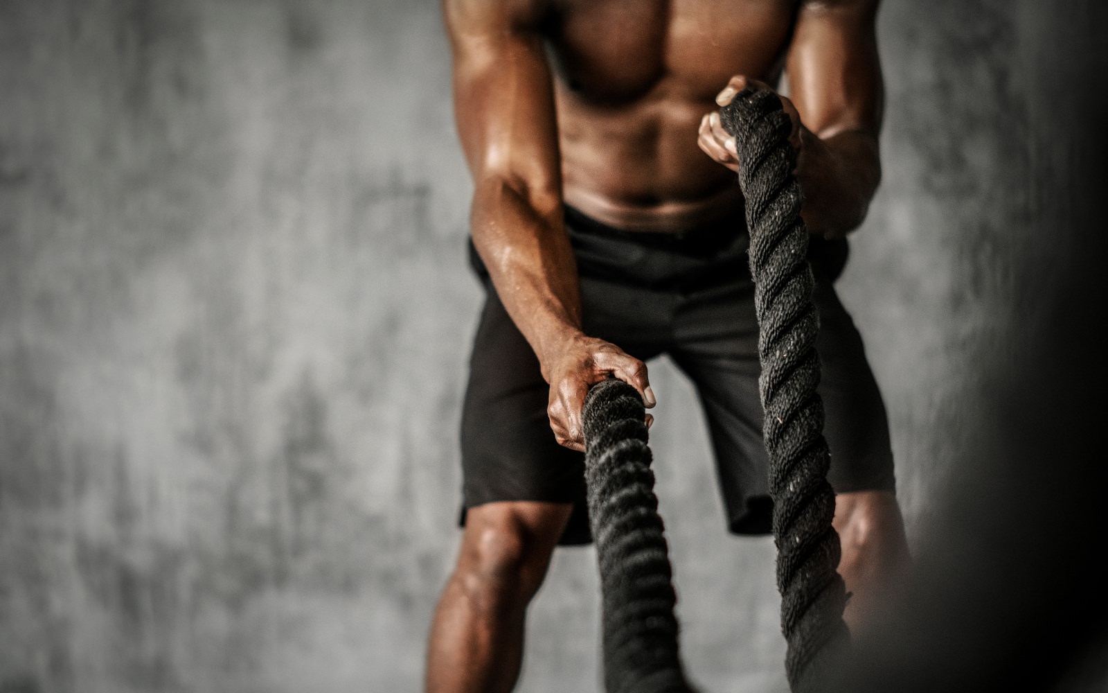 a man doing rope exercises