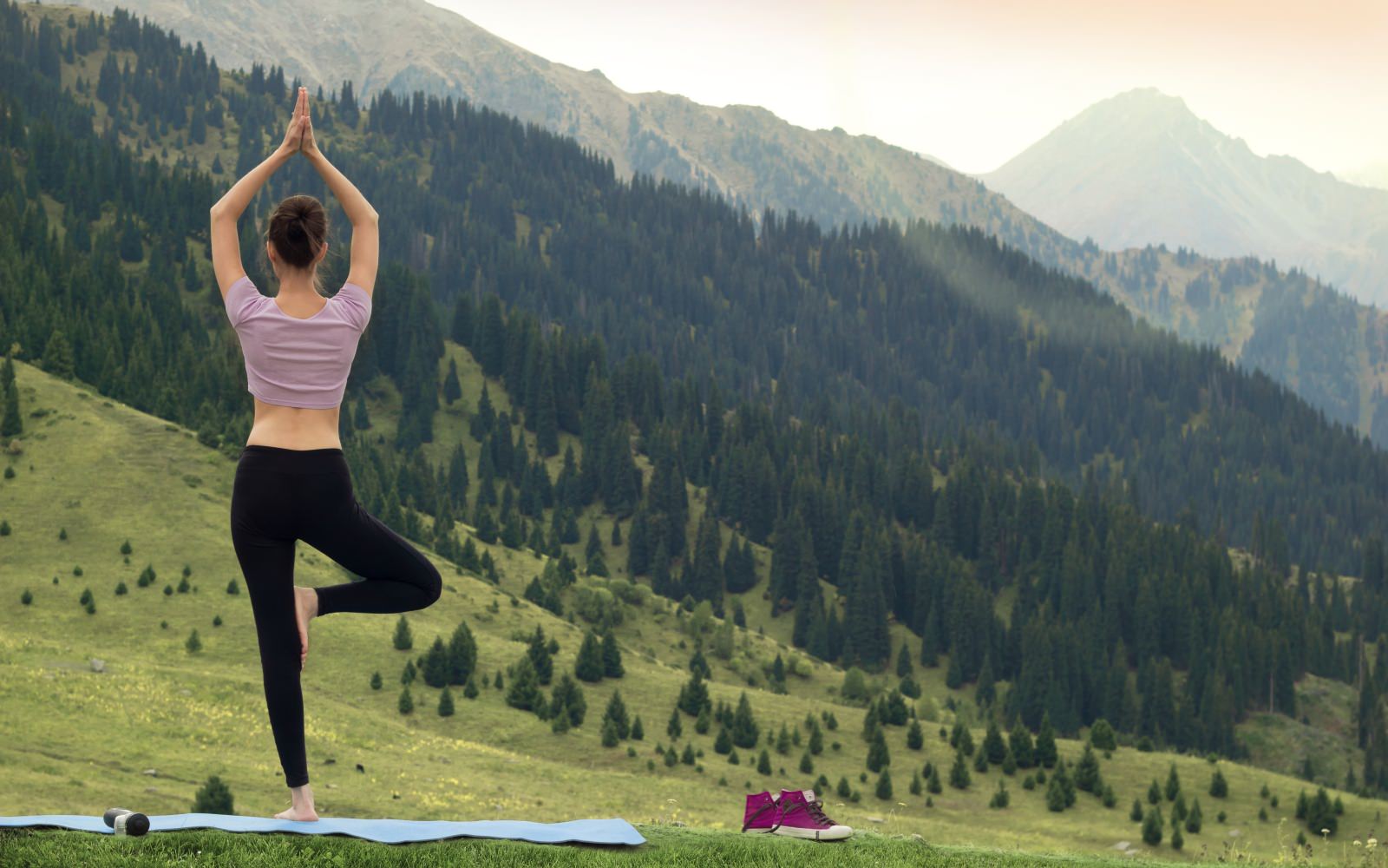 woman standing on one foot doing yoga